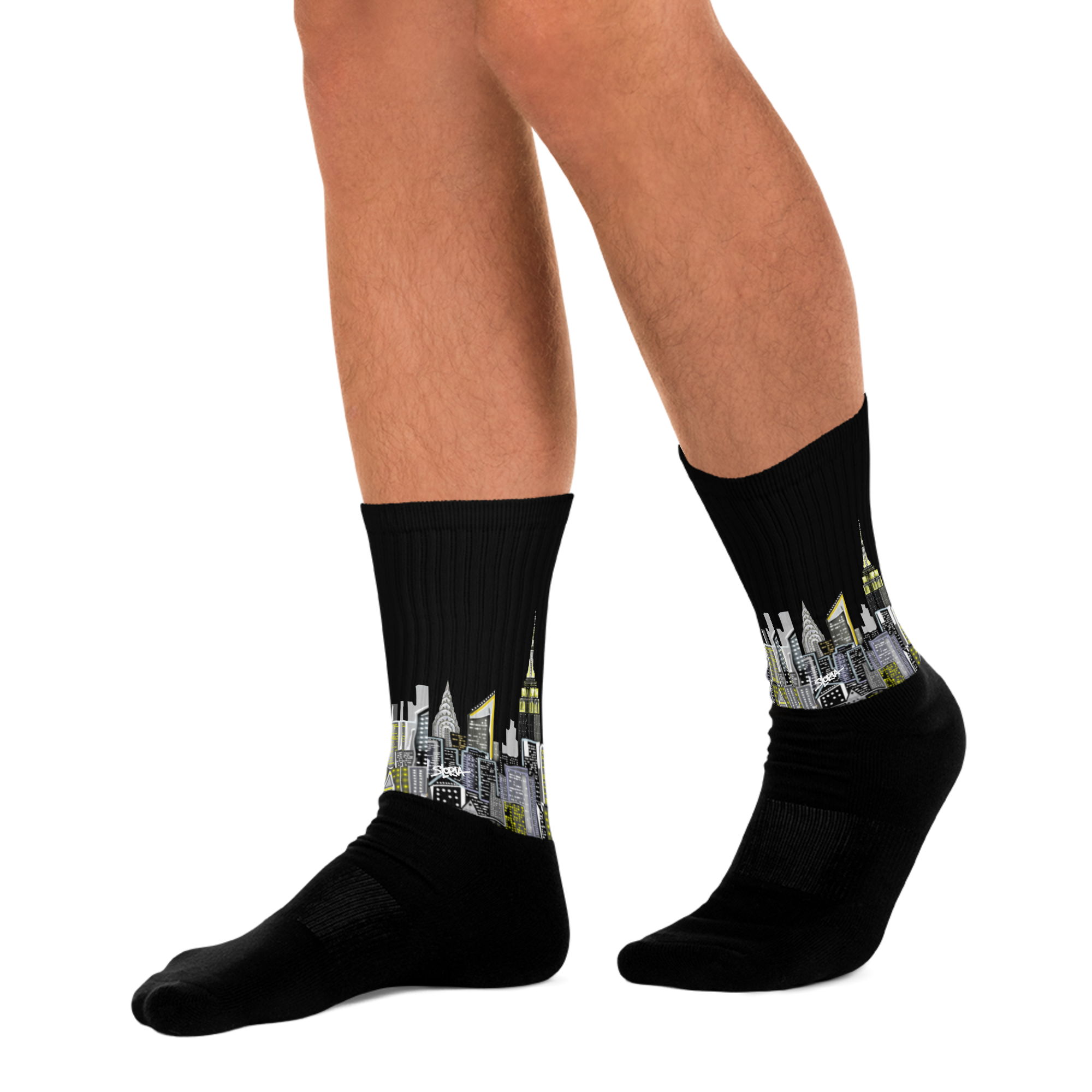 Black socks with cityscape Loria NYC Art design worn by a person on a white background