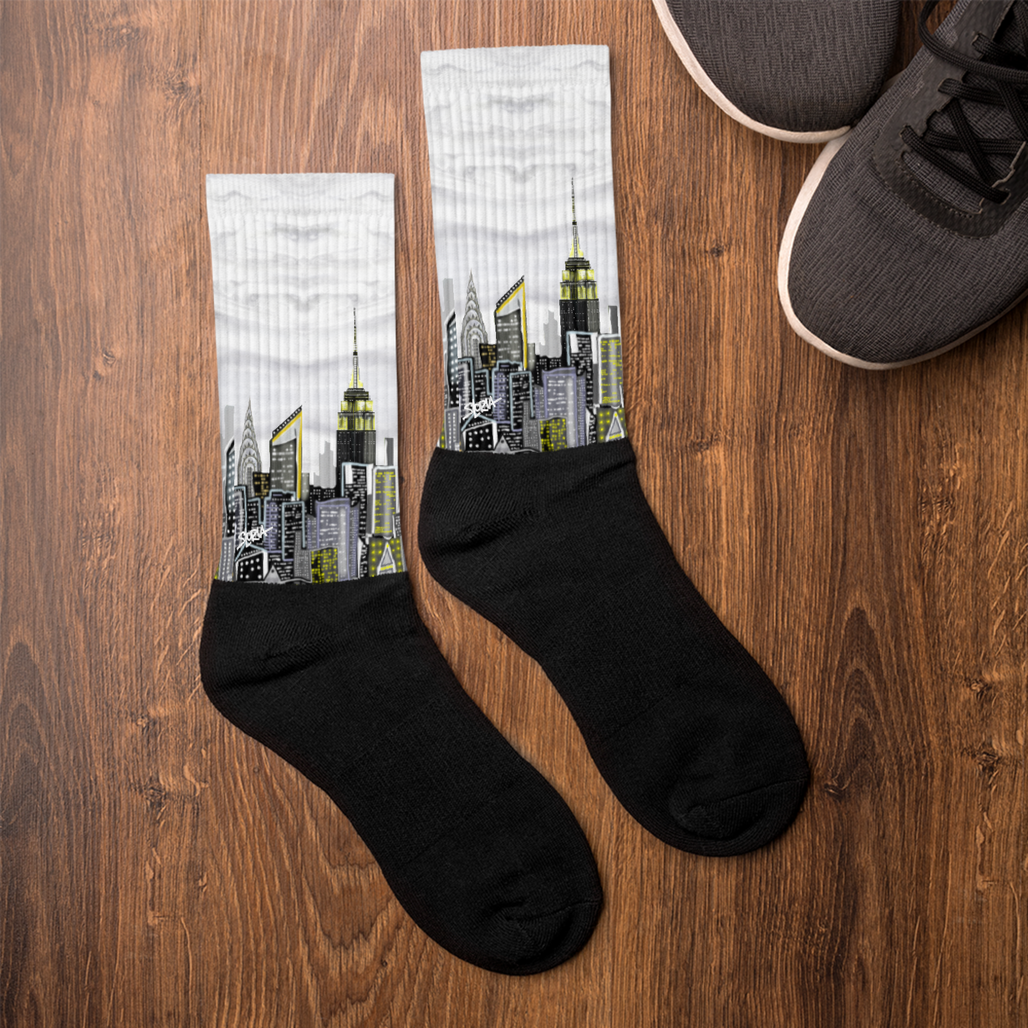 Black socks with cityscape Loria NYC Art design on a wooden surface