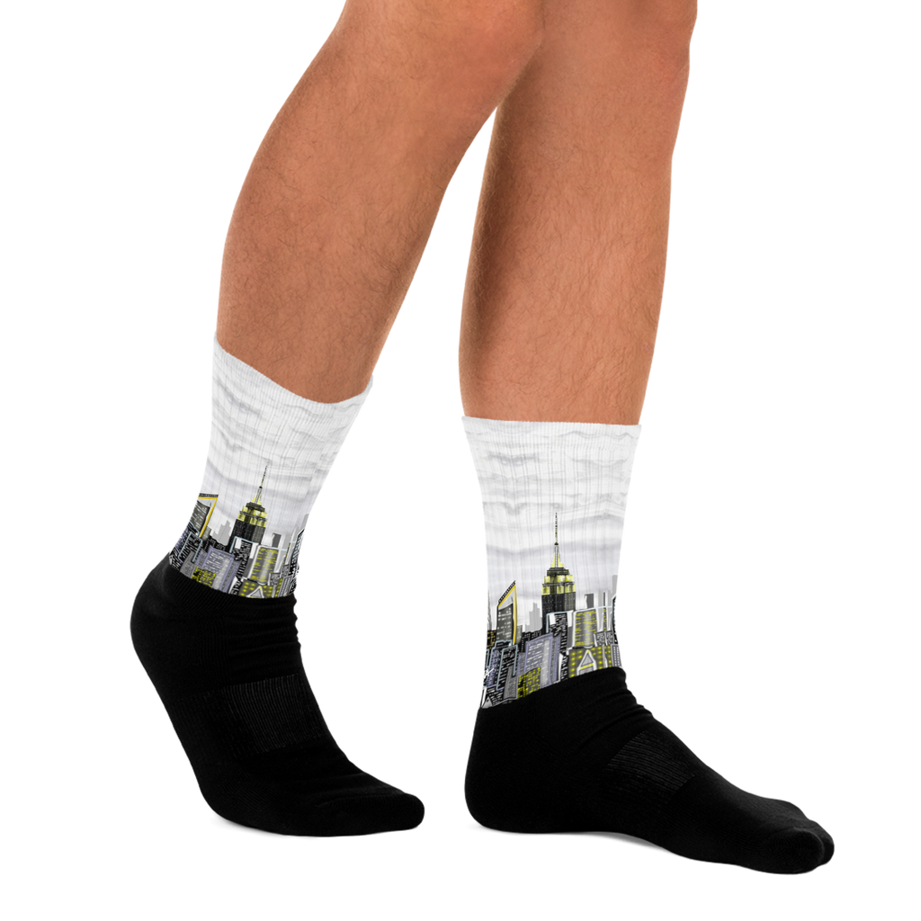 Person wearing socks with city skyline Loria NYC Art design on a white background