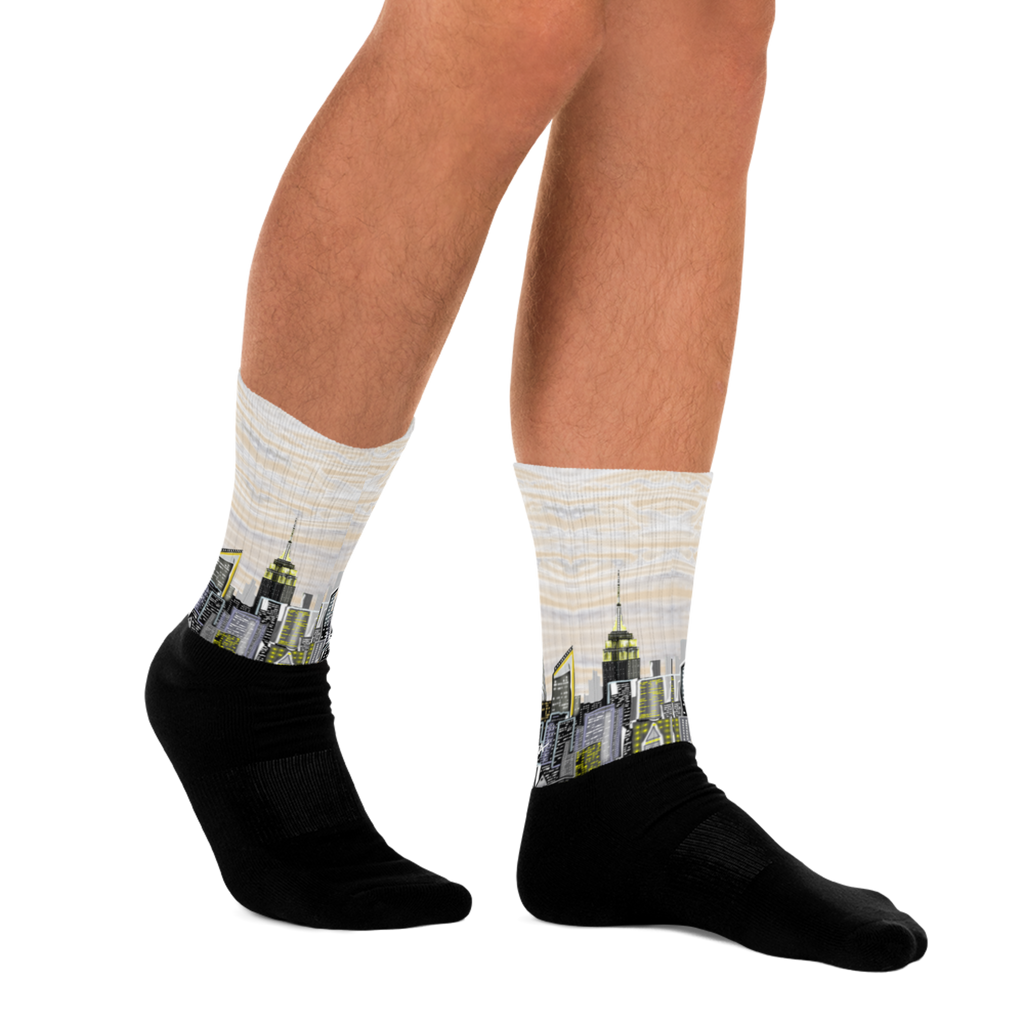 Person wearing Loria NYC Art socks with city skyline design on a white background