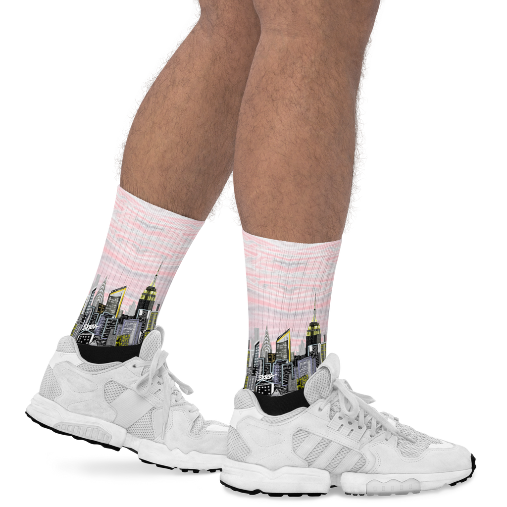White sneakers with socks featuring city skyline Loria NYC Art designs on a white background