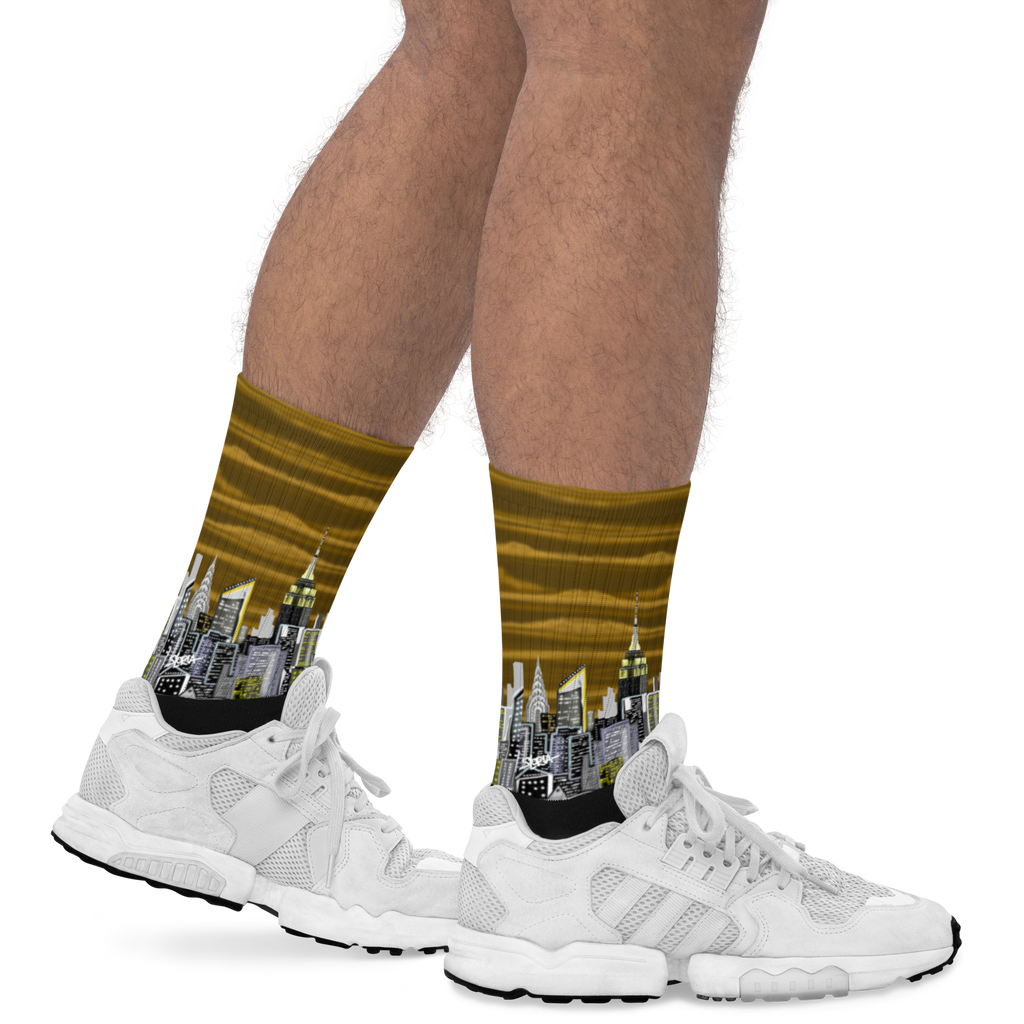 Cityscape Loria NYC Art socks worn with white sneakers on a white background