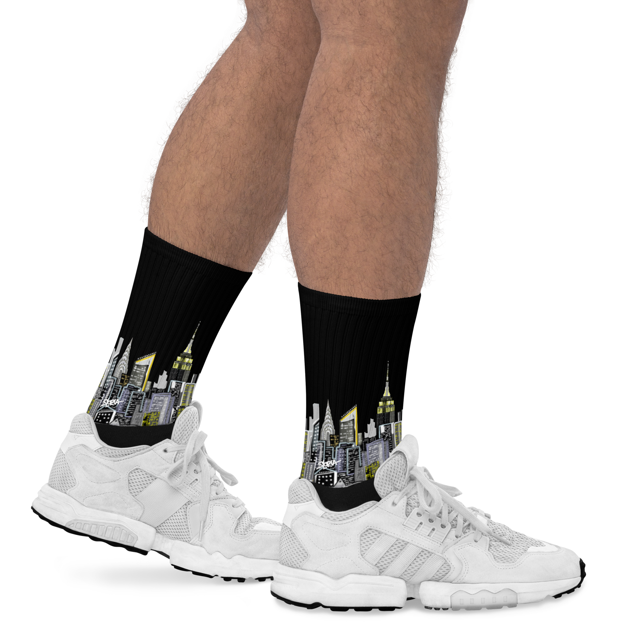 Cityscape Loria NYC Art socks worn with white sneakers on a white background