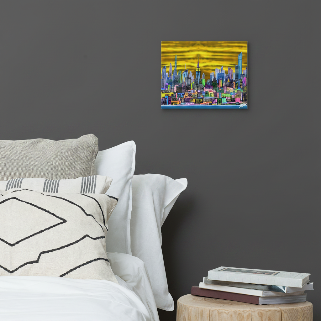 Colorful 11’’ x 14’’ Canvas by Loria NYC Art cityscape painting on a wall above a bed with pillows and books.