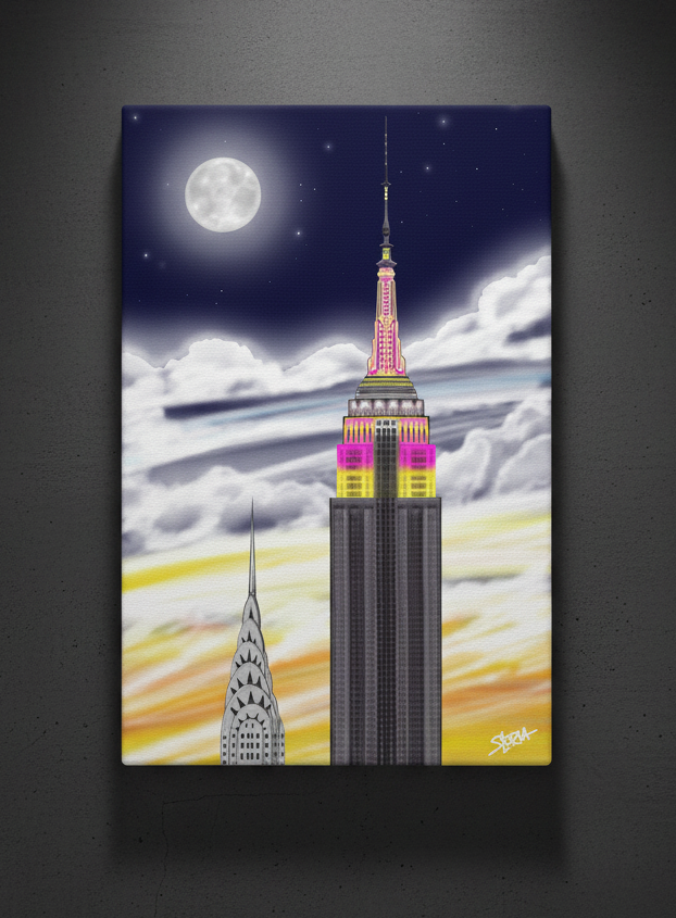 Loria NYC Art Canvas print of the Empire State Building under a moonlit sky with colorful lights.