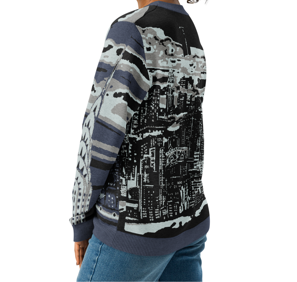 Woman wearing a sweater with a cityscape Loria NYC Art design on a white background