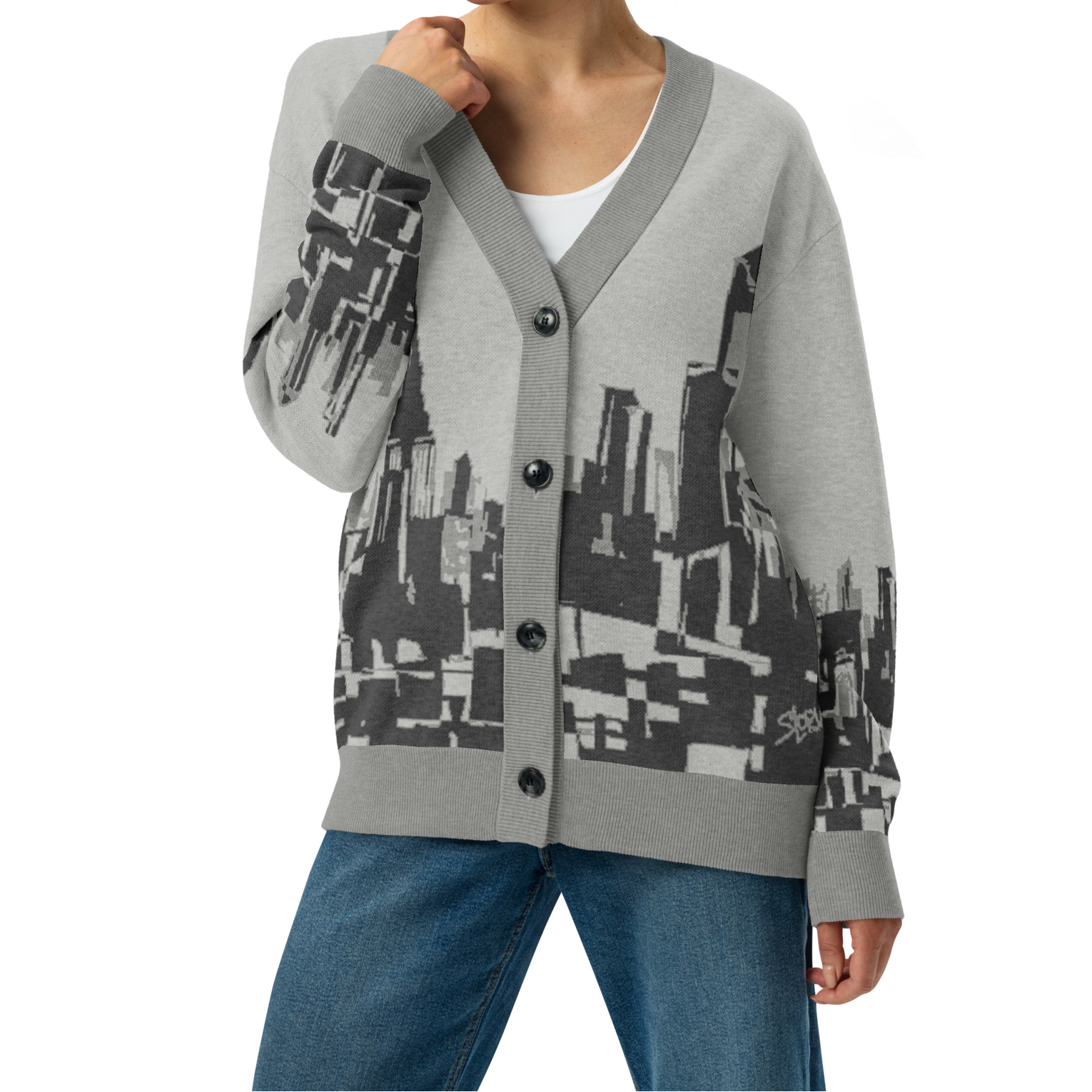 Woman wearing a gray Loria NYC Art cardigan with geometric pattern on a white background