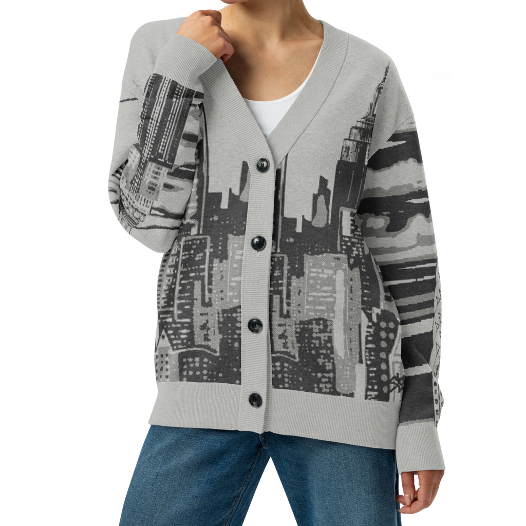 Woman wearing a gray cardigan with black Loria NYC Art on a white background