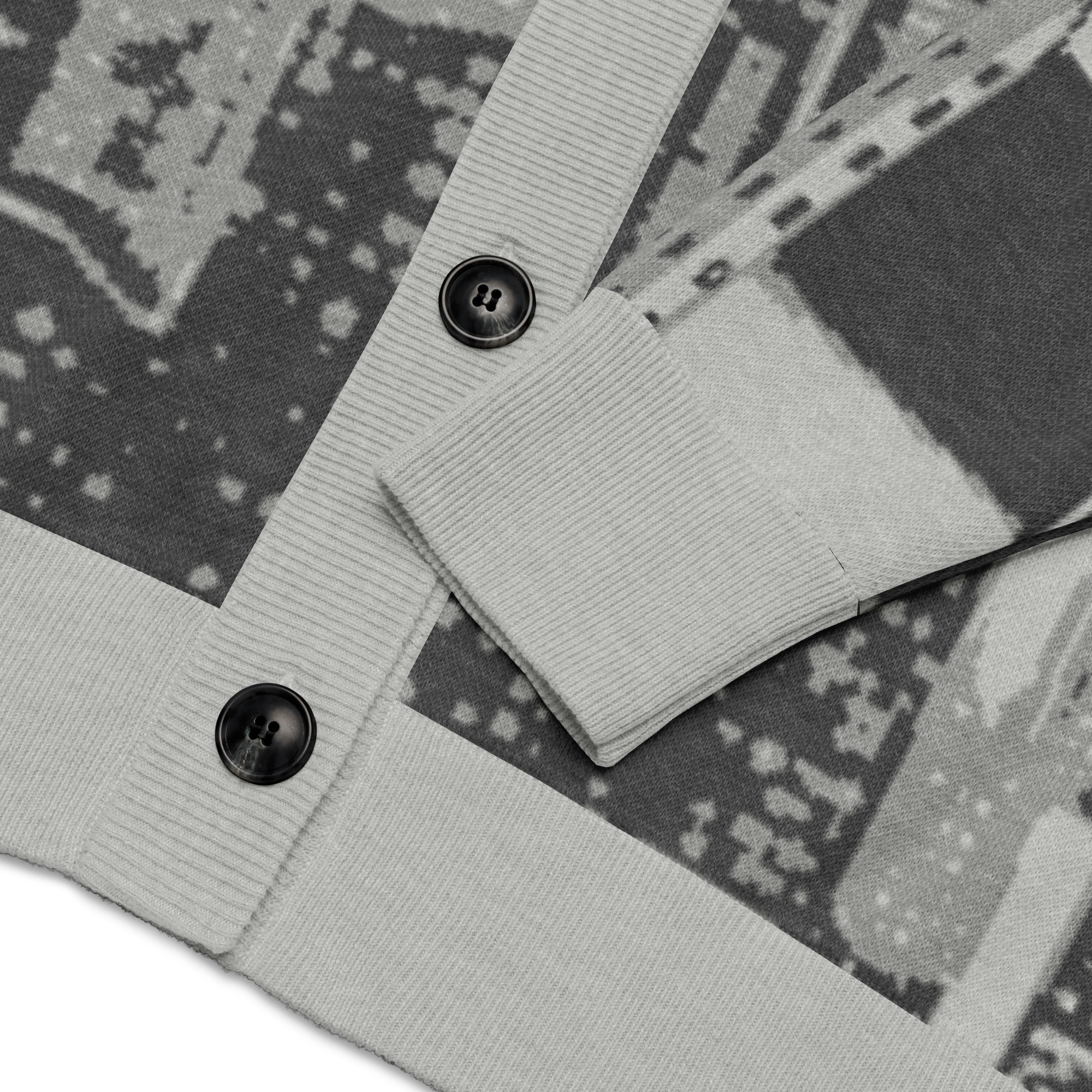 Close-up of a gray fabric with Loria NYC Art design on a patterned background