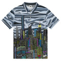 Polo shirt with Loria NYC Art cityscape design on a white background