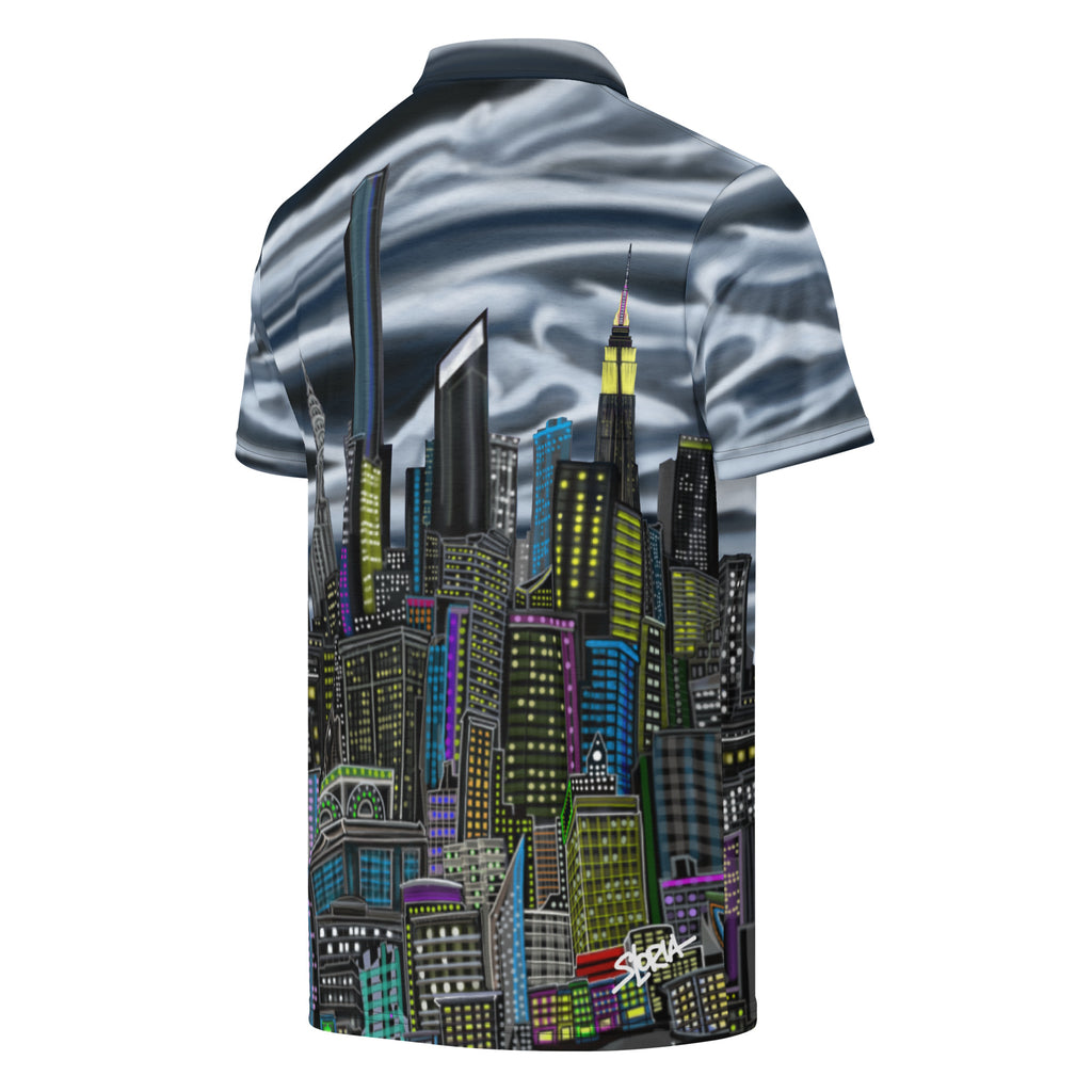 Polo shirt with cityscape design and 'S. Loria' NYC Art branding on a white background