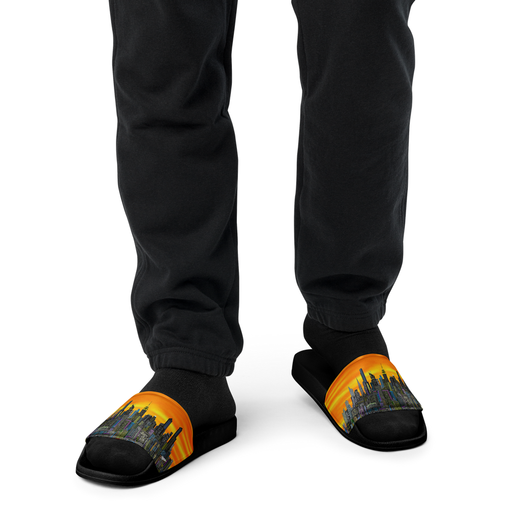 Slippers with a cityscape Loria NYC Art design worn by a person in black pants on a white background