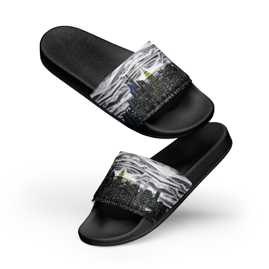 Black slide sandals with a Loria NYC Art cityscape design on a white background