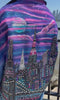 Colorful wearable Loria NYC Art jacket with crystals reflecting outside and city skyline in the background.