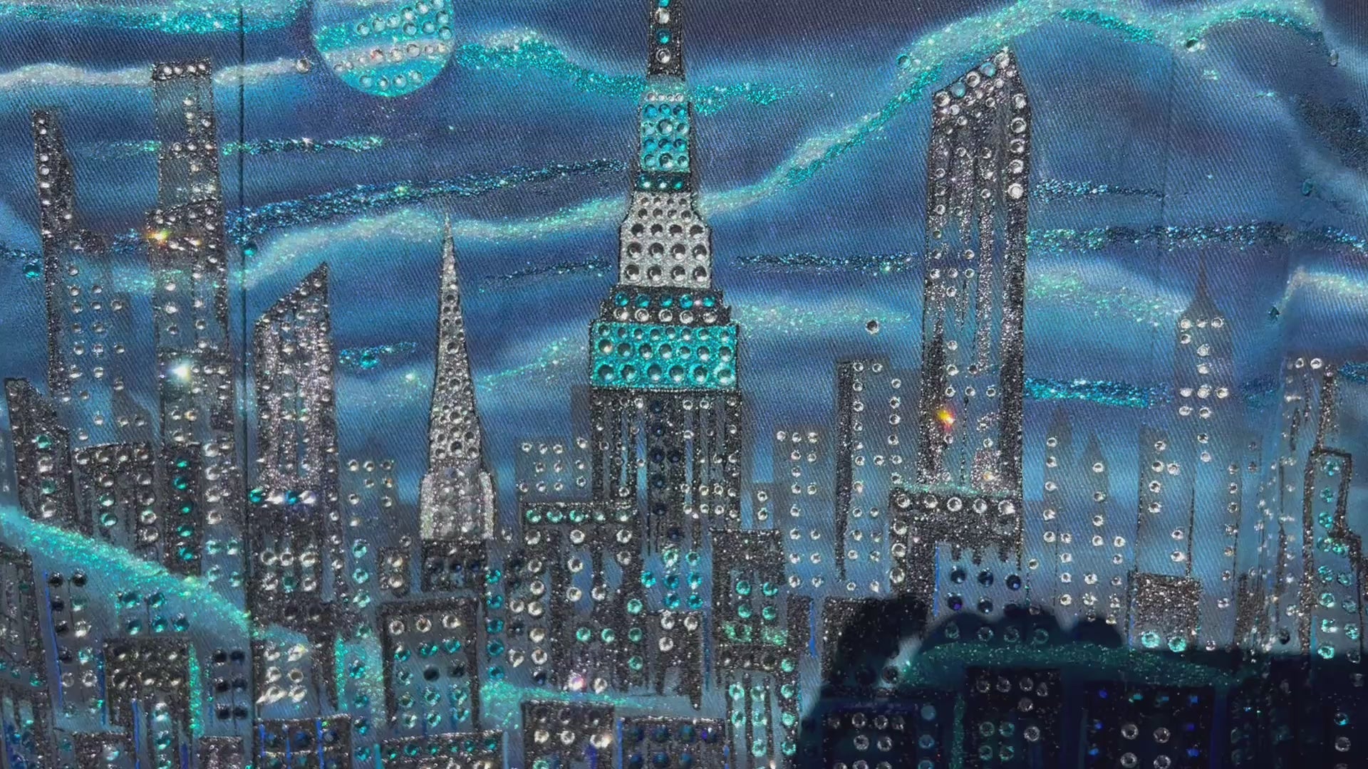 Horizontal Video of jacket covered in blue Loria NYC Art with skyline background