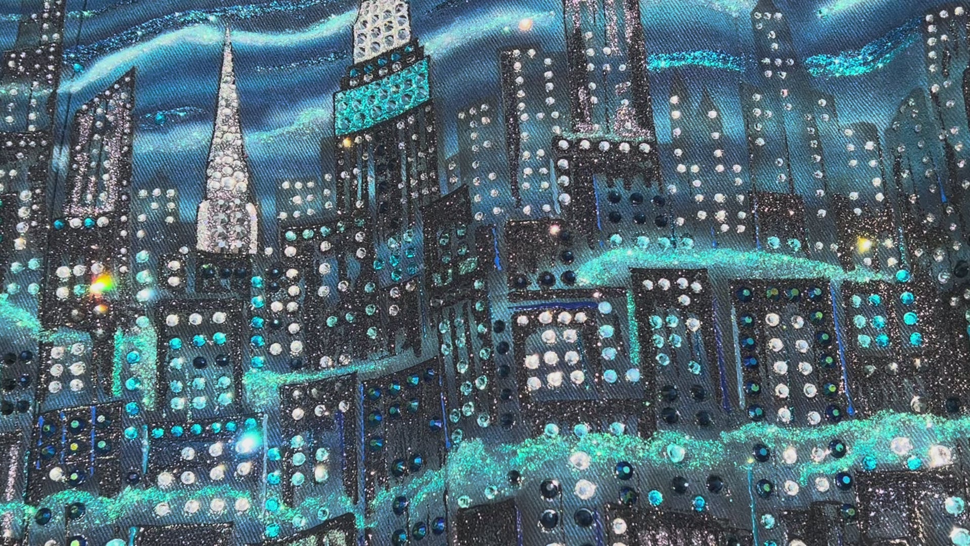 Detailed video of  jacket covered in Loria NYC Art with colorful skyline on a sunny day