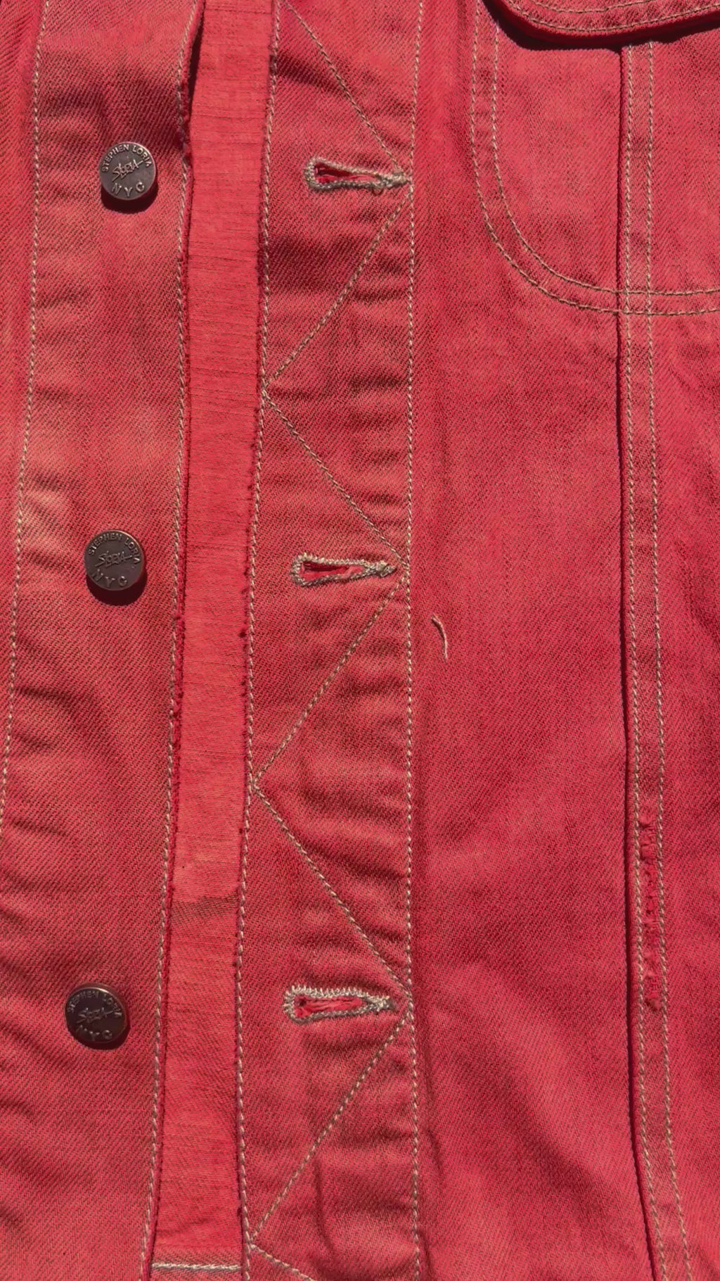 Font of orange Loria NYC Art jacket in a video format