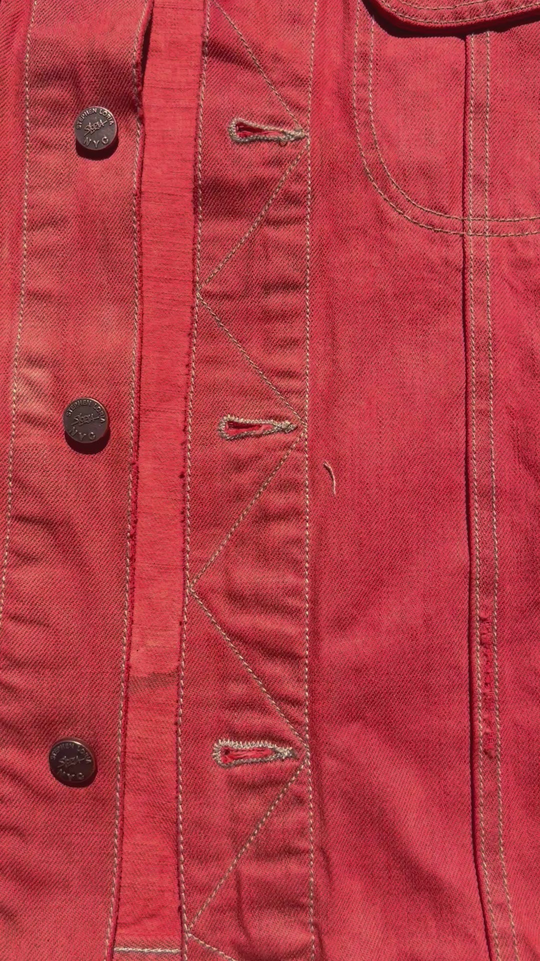 Font of orange Loria NYC Art jacket in a video format