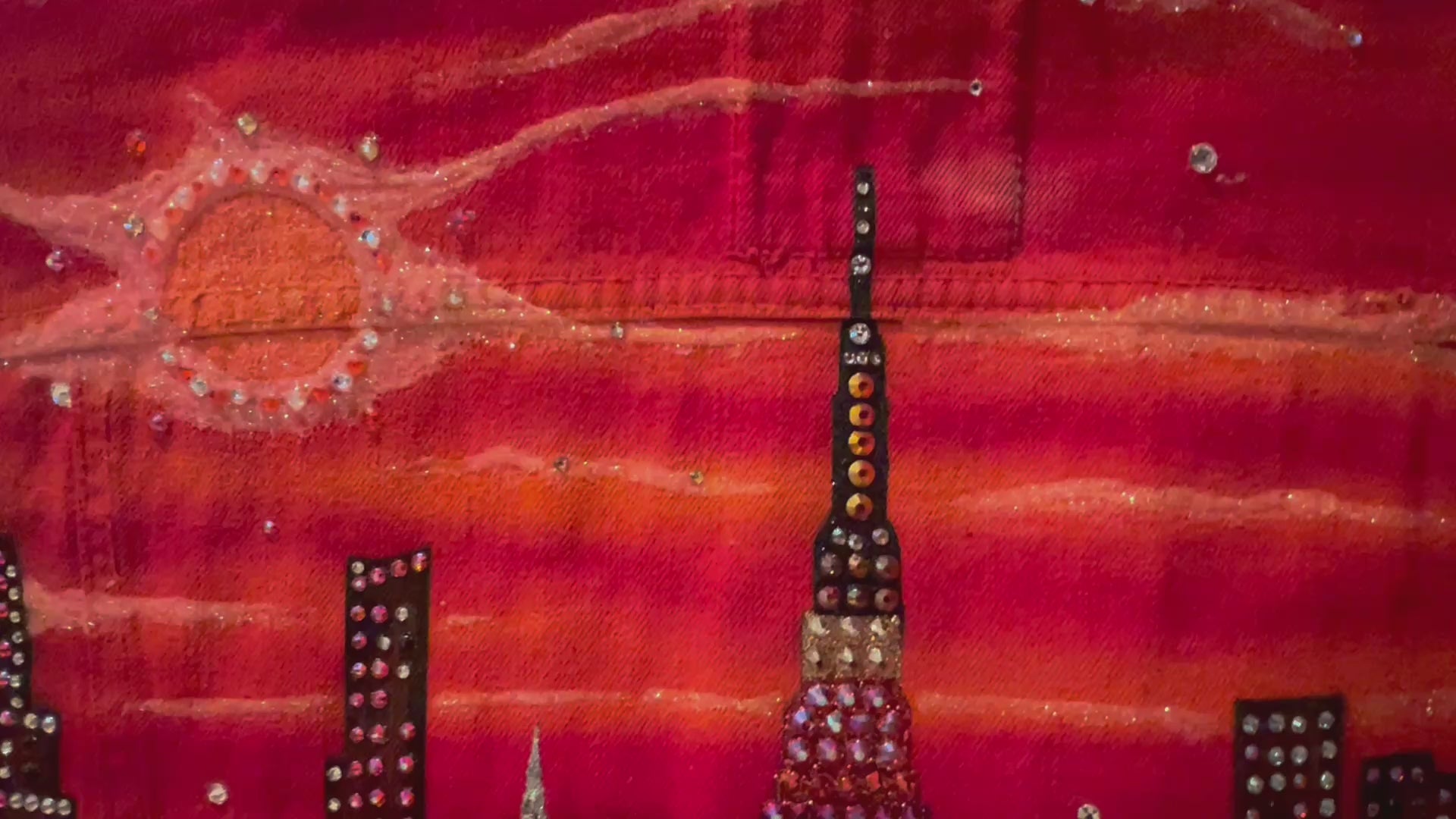 Video clip of Loria NYC Art o the back of a jacket