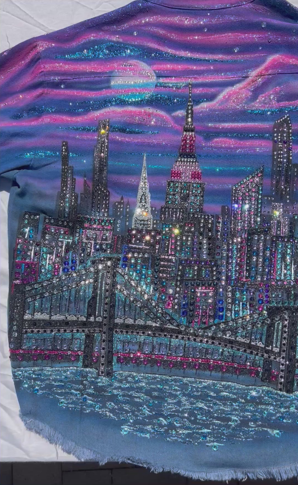 Colorful wearable Loria NYC Art jacket with crystals reflecting in sunlight.