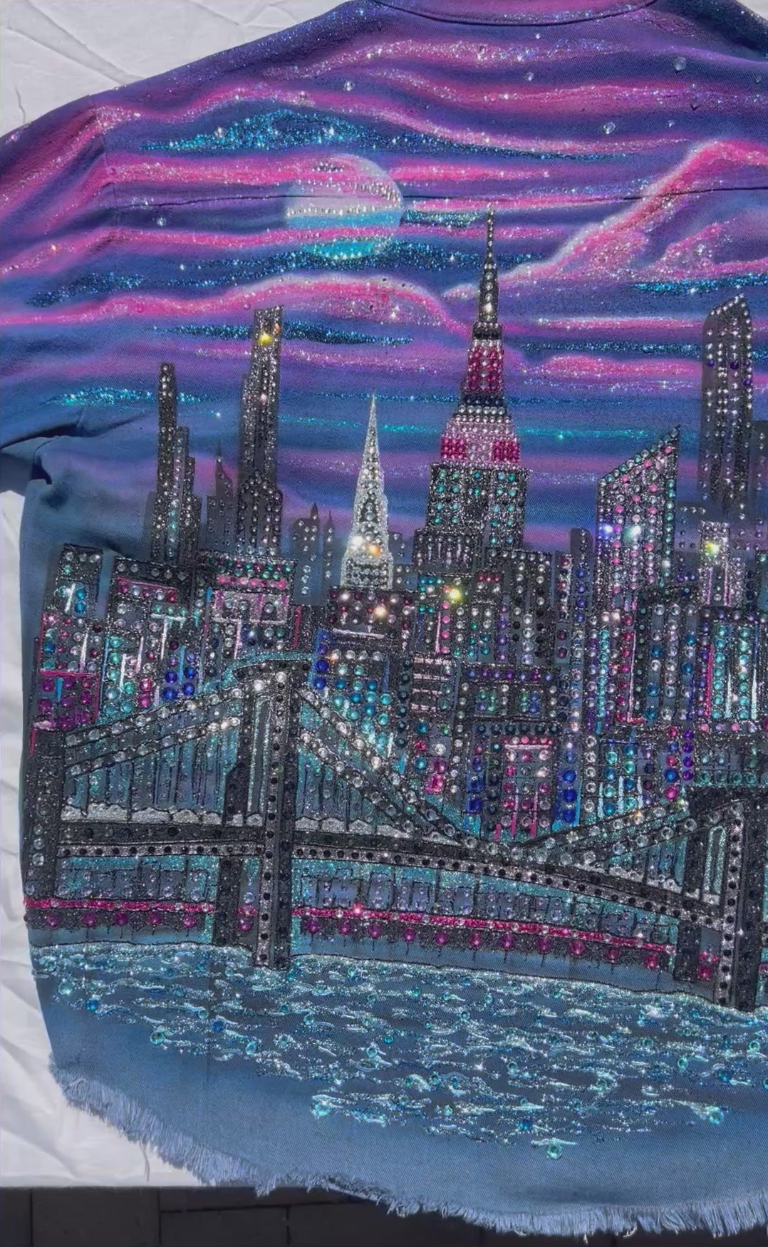 Colorful wearable Loria NYC Art jacket with crystals reflecting in sunlight.