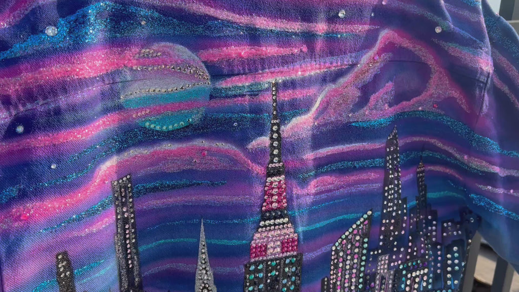 Close up Video of a unique colorful Loria NYC Art jacket with the city skyline in the background 