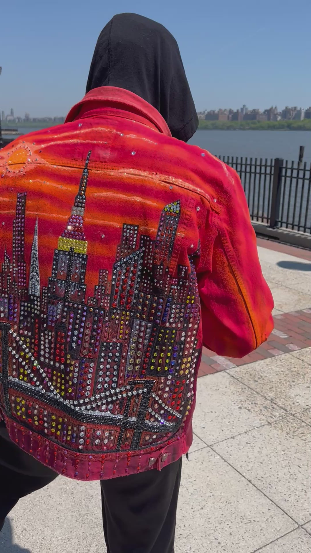 Man wearing an original Loria NYC Art handmade orange jacket.