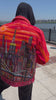 Man wearing an original Loria NYC Art handmade orange jacket.