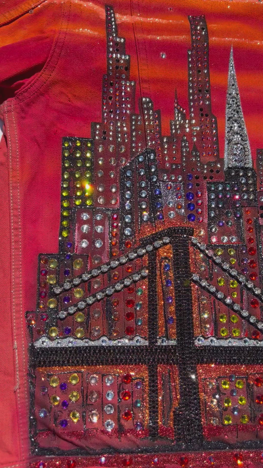 Loria NYC Art orange jacket video with reflecting light on back