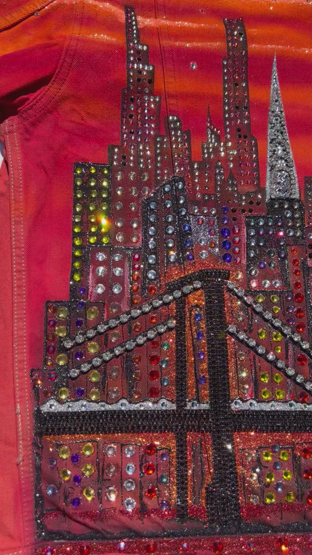 Loria NYC Art orange jacket video with reflecting light on back