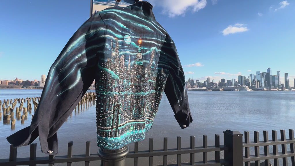 Horizontal video of a  jacket covered in Loria NYC Art with  skyline background 