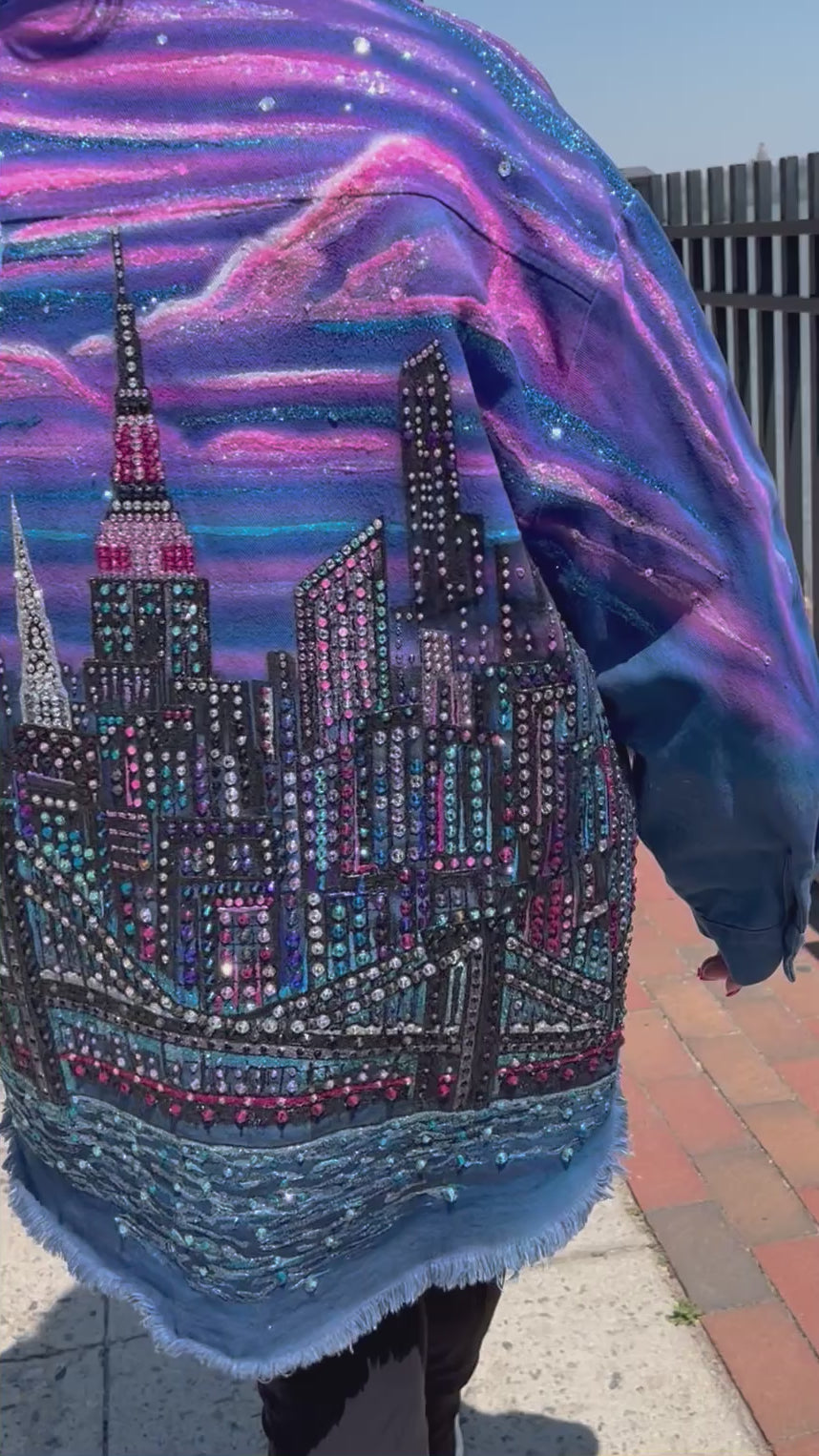Women walking in colorful wearable Loria NYC Art jacket with crystals reflecting in sunlight.