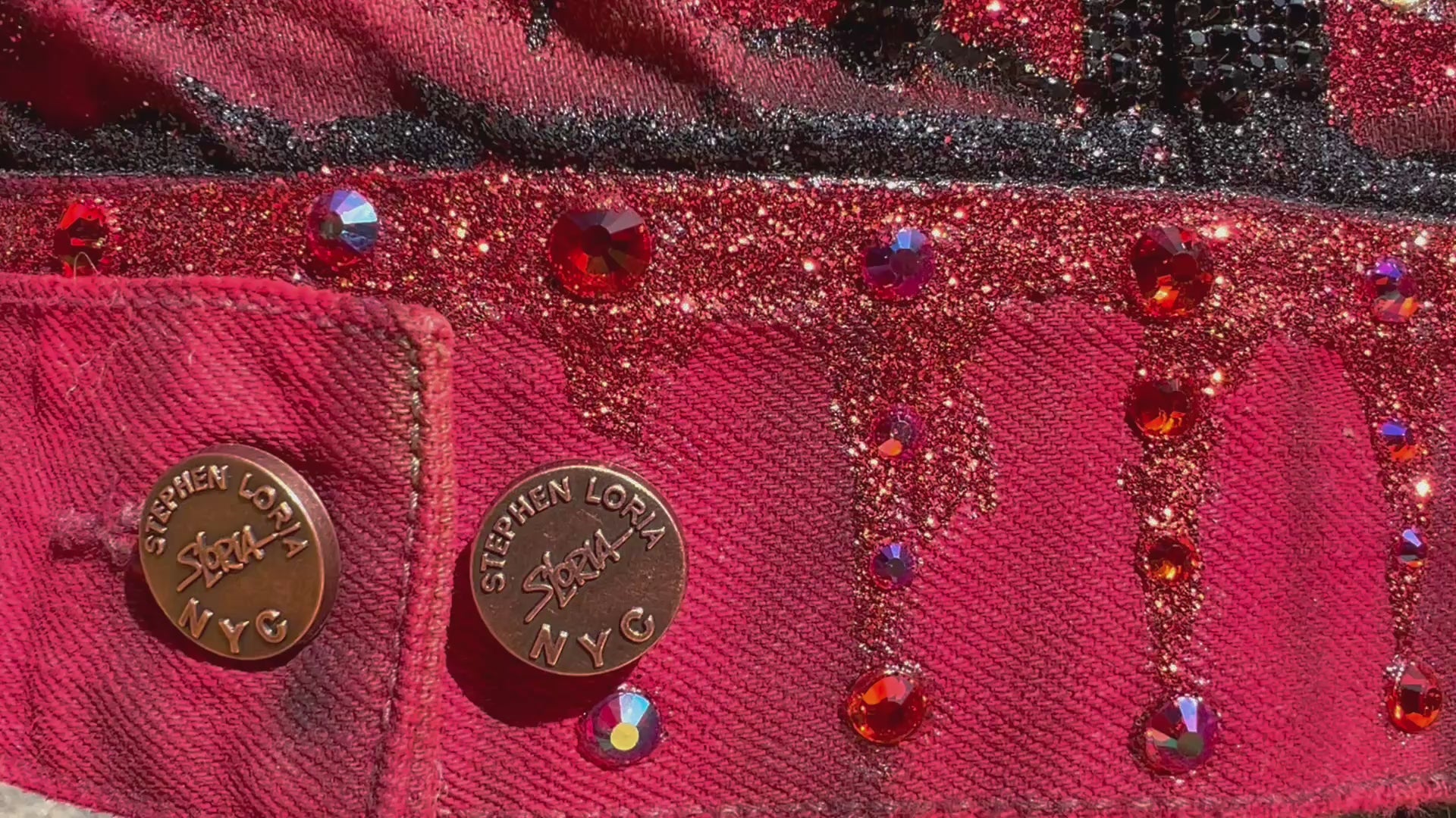 Detailed video of a jacket with Loria NYC Art on the back with custom buttons