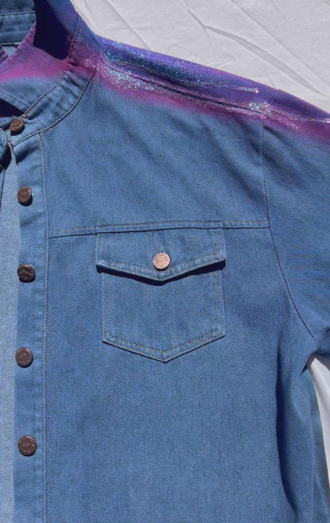 Front of wearable Loria NYC Art blue denim jacket