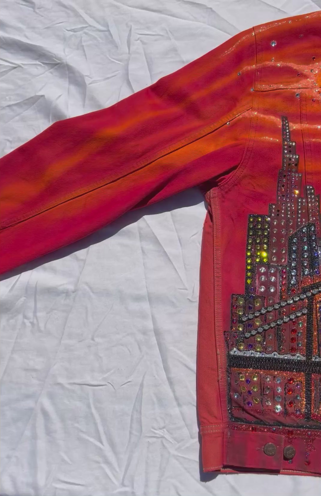 Orange Loria NYC Art jacket on white background video
