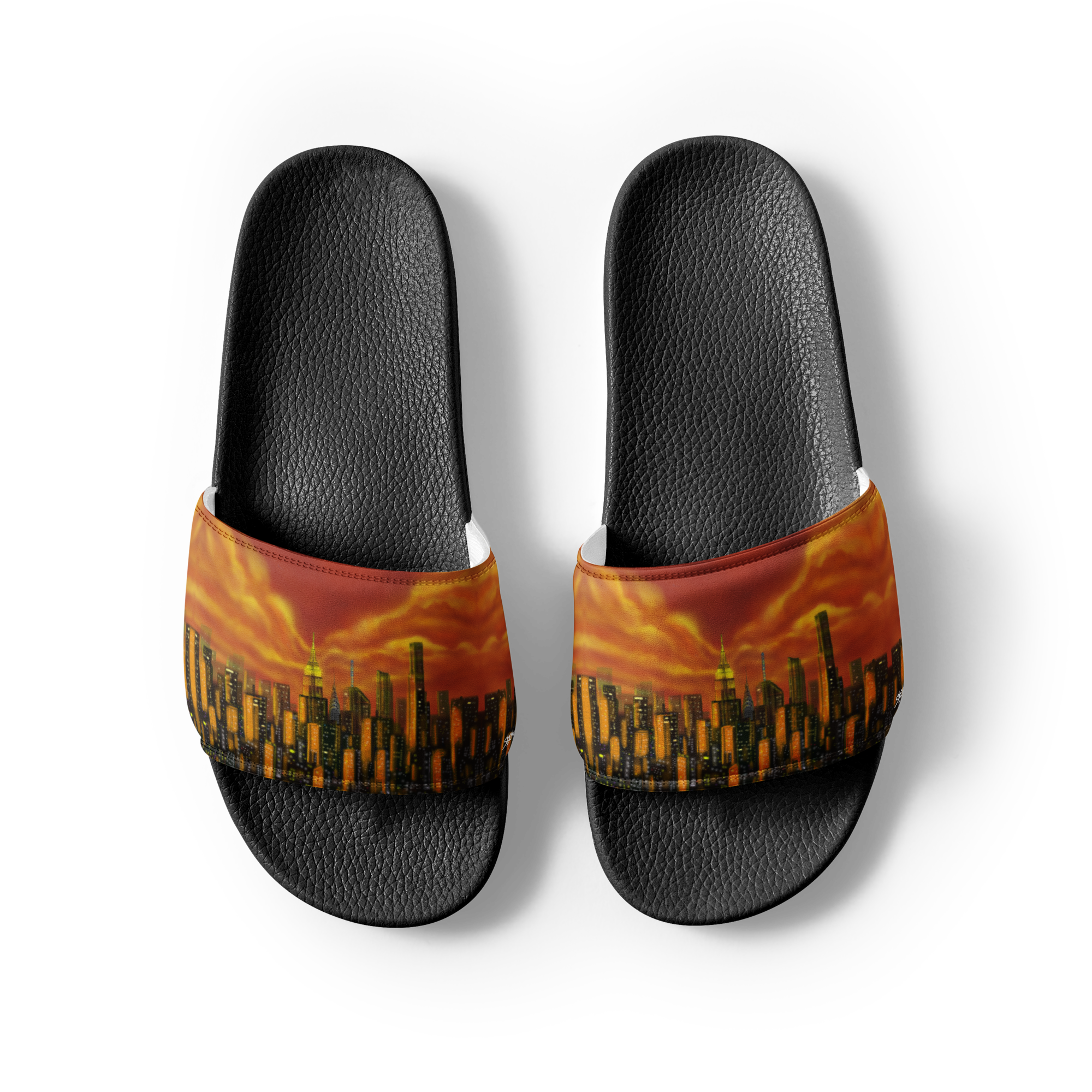 Black slide sandals with a Loria NYC Art cityscape design on a white background