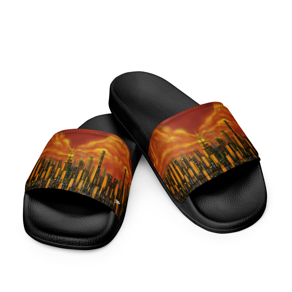 Black slide sandals with a fiery Loria NYC Art cityscape design on a white background