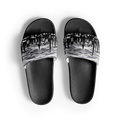 Black slide sandals with a Loria NYC Art cityscape design on a white background