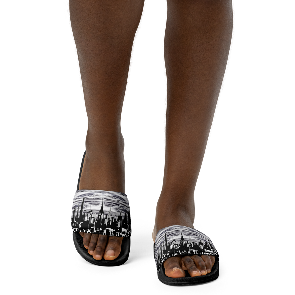 Black sandals with white cityscape Loria NYC Art design worn by a person on a white background