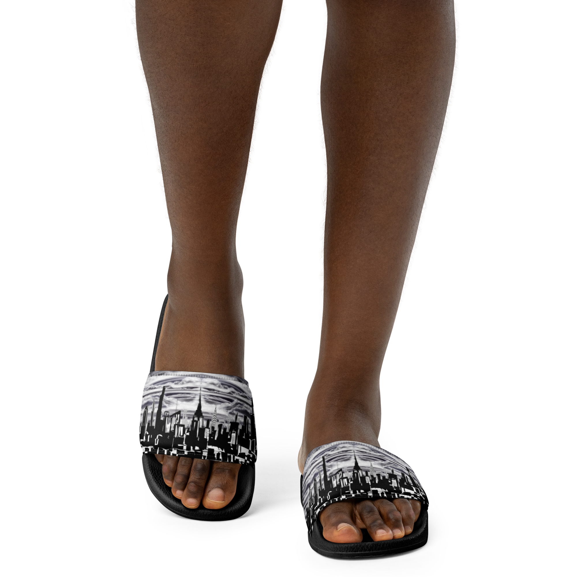 Black sandals with white cityscape Loria NYC Art design worn by a person on a white background