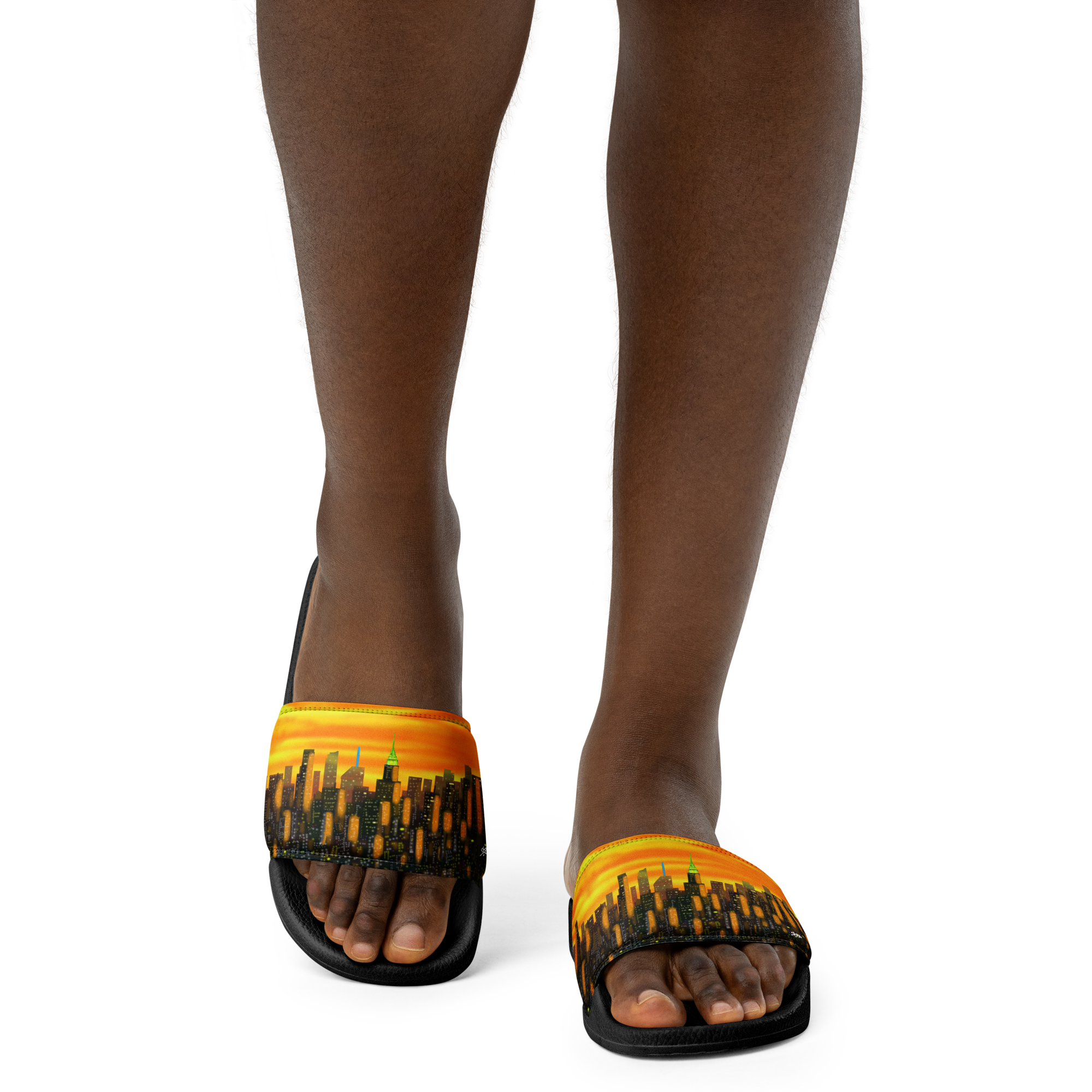 Black sandals with orange and yellow Loria NYC Art design on a white background