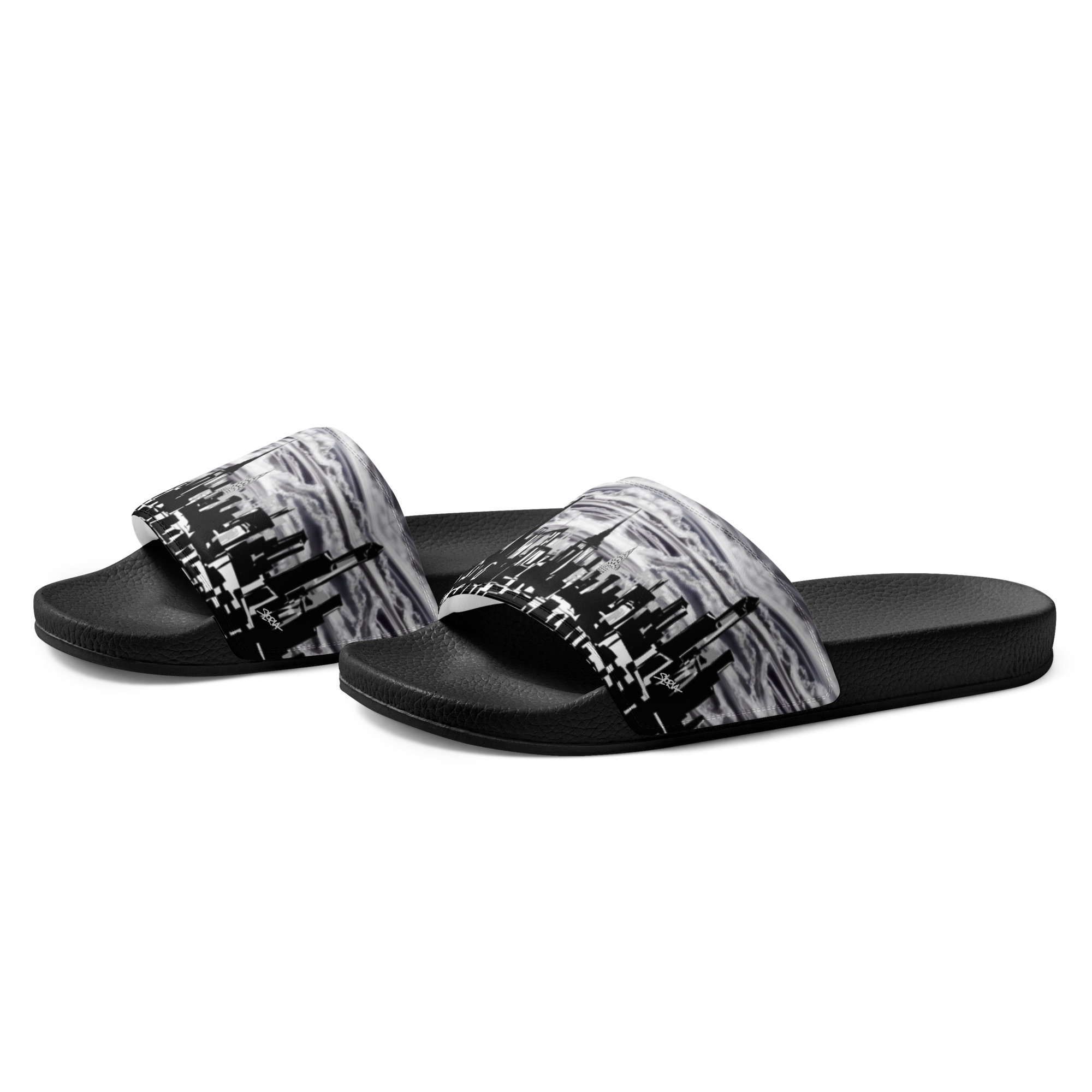 Black and white designed Loria NYC Art sandals on a white background
