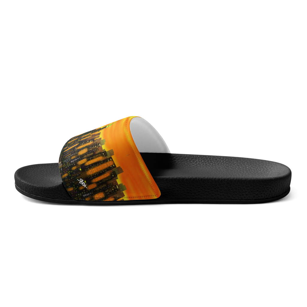 Black slide sandal with orange and yellow Loria NYC Art on a white background